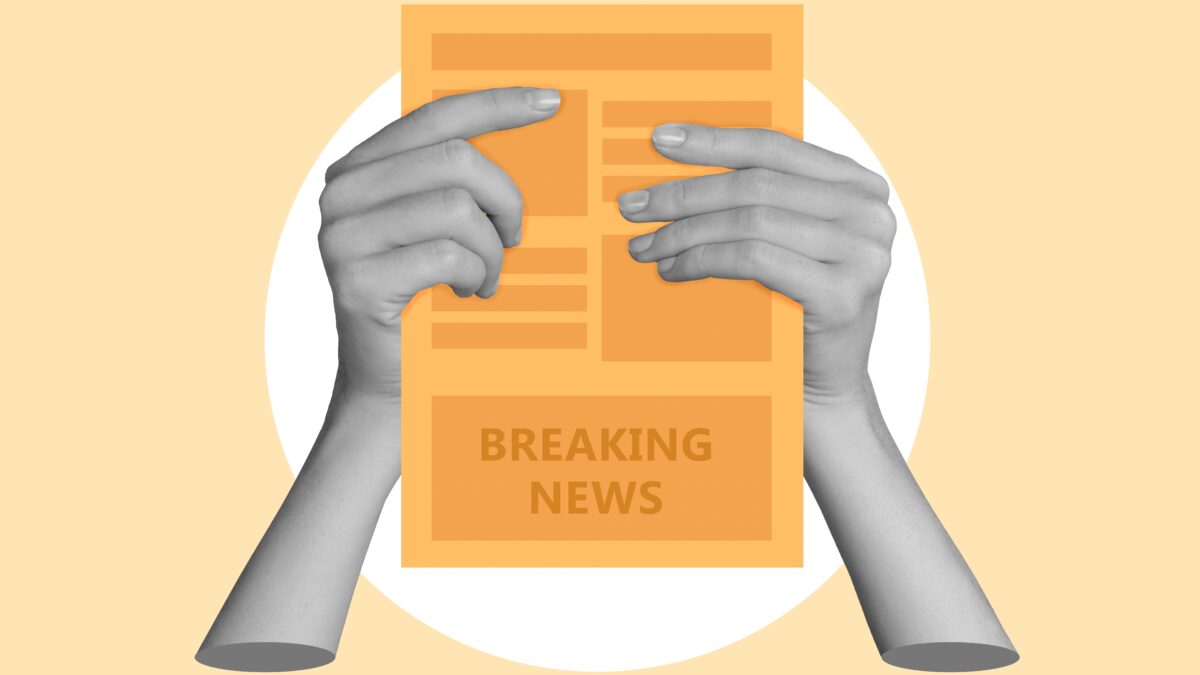 A pair of hands holding a newspaper that says "breaking news" against a yellow background